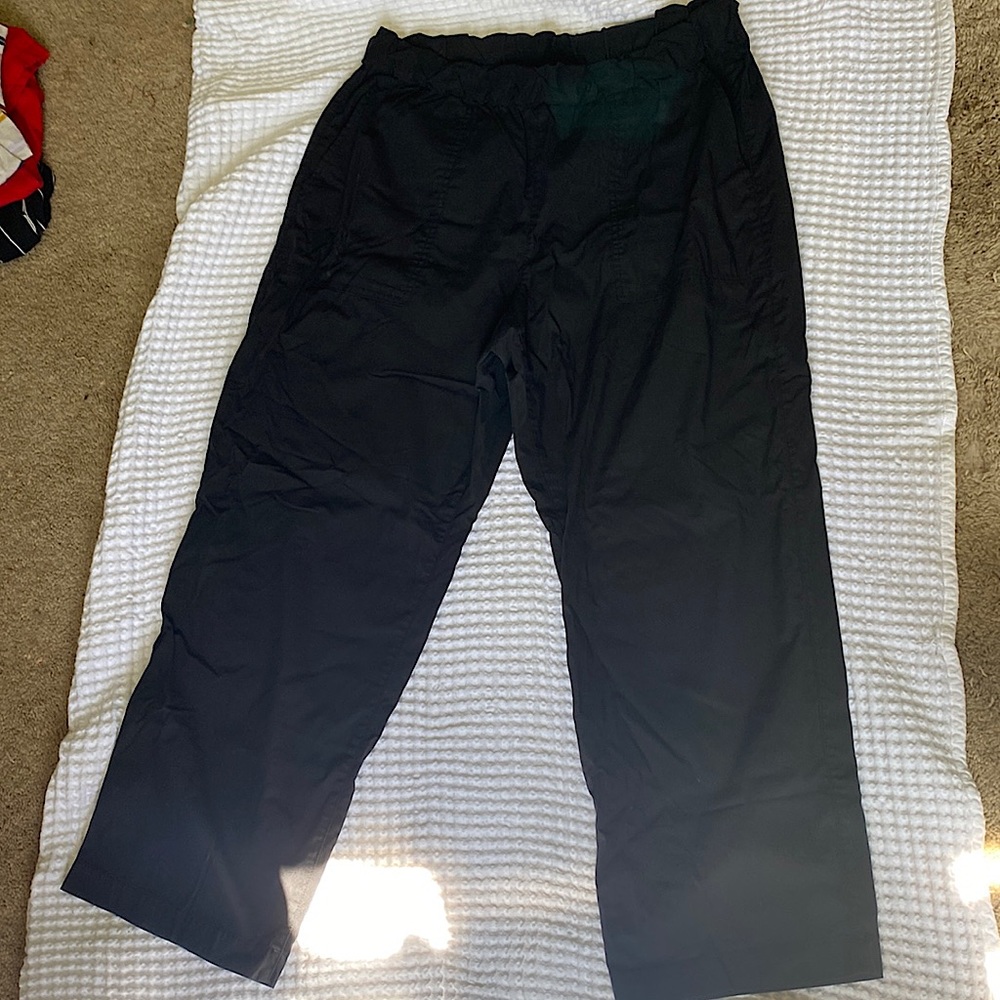 Black pants. Pockets in front and back wide leg. Hits around ankle.